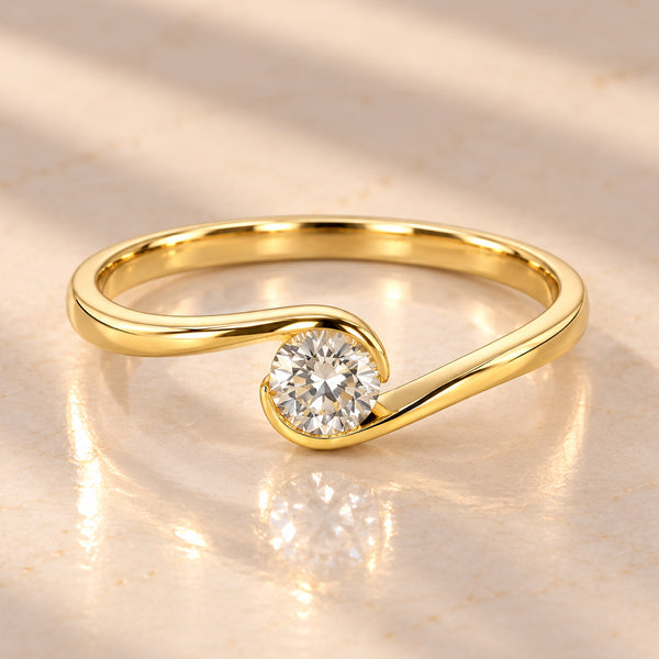 9ct yellow gold crossover ring with 0.18ct round brilliant natural diamond