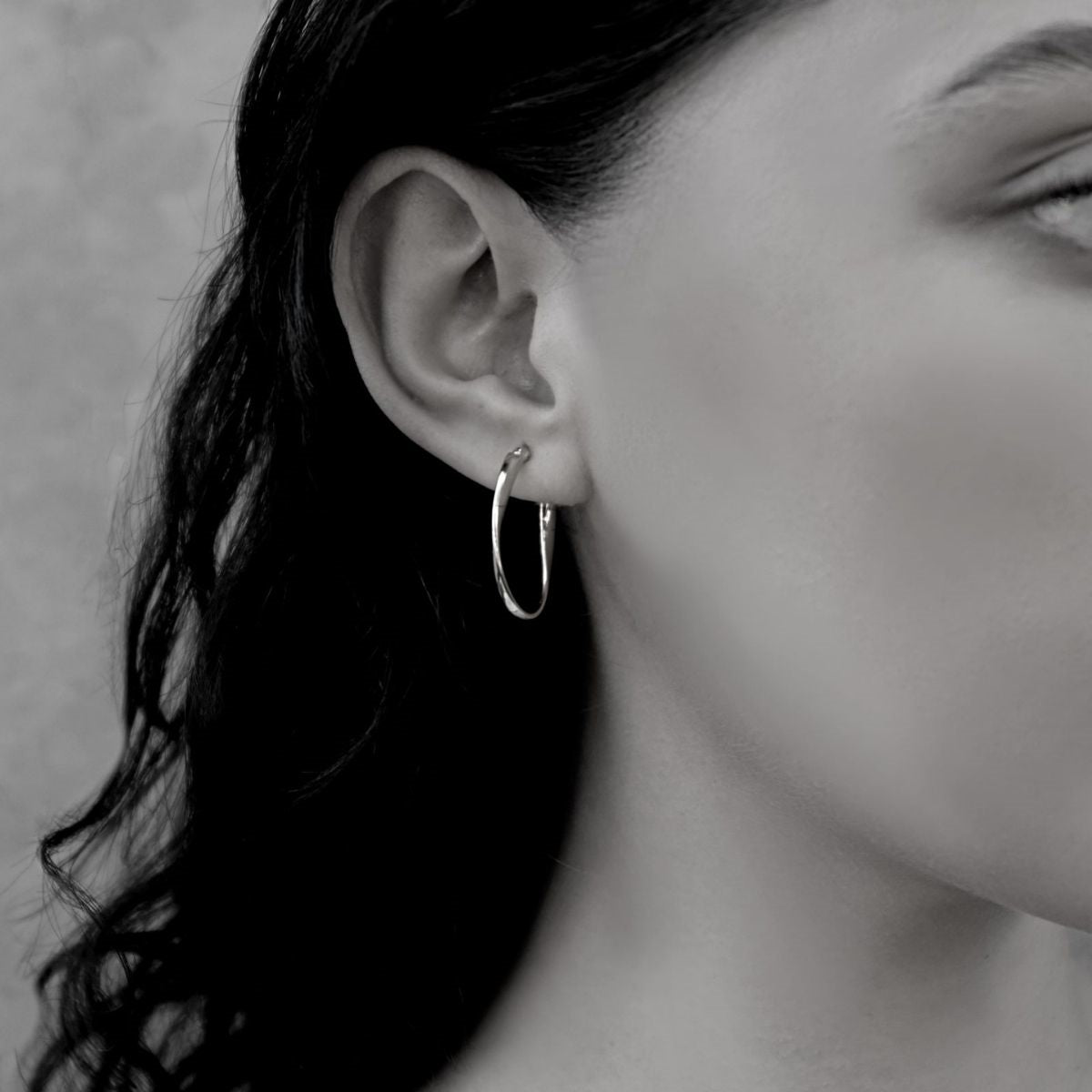 Sterling Silver Twisted Ribbon Oval Hoop Earrings