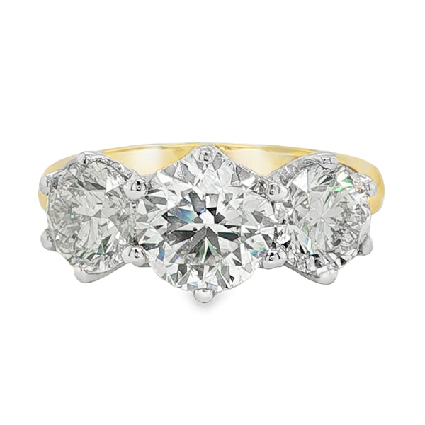 4.02ct diamond trilogy ring in 18ct yellow and white gold featuring three round brilliant diamonds