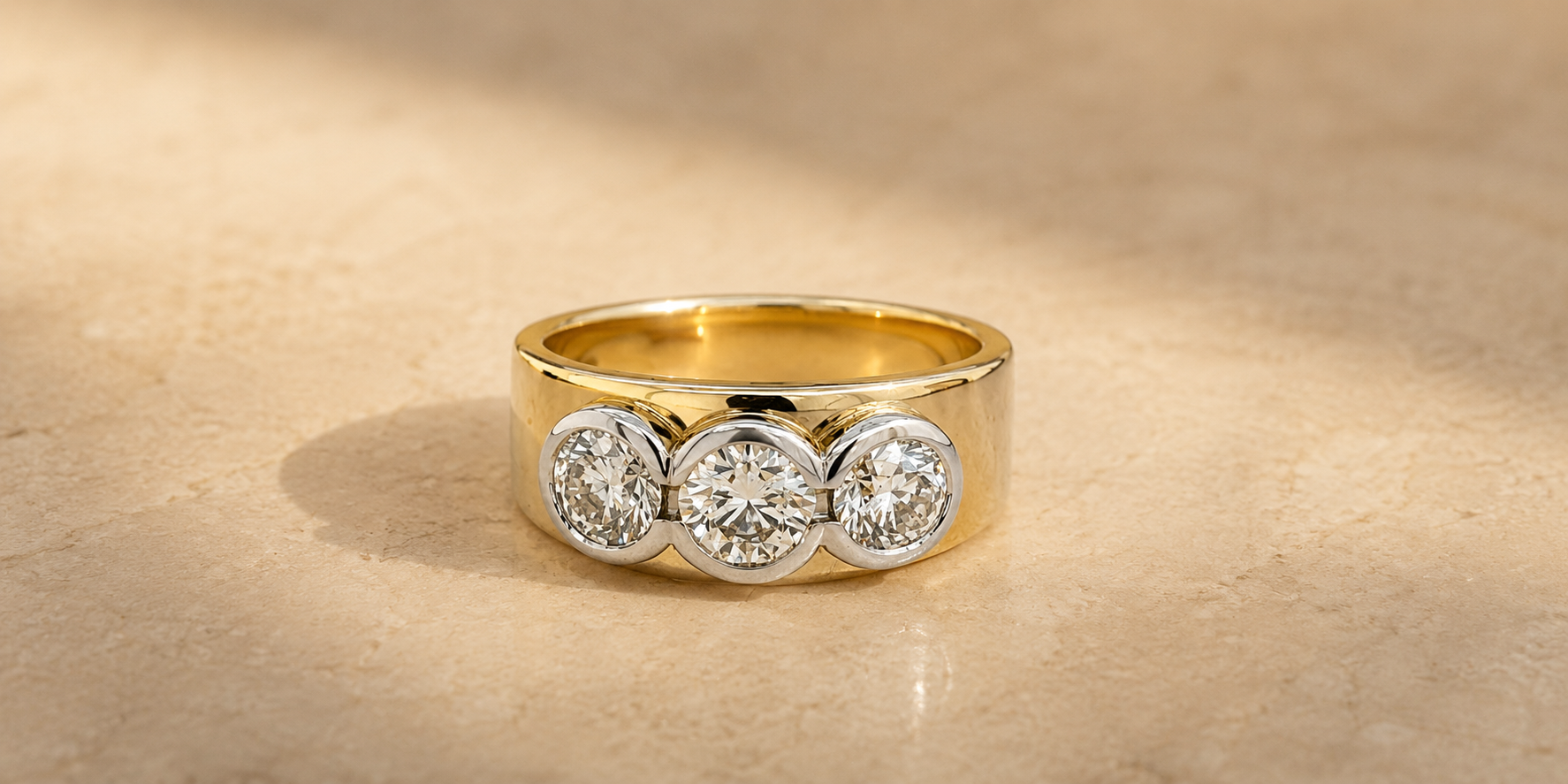 Remodelled yellow gold three diamond ring created from existing jewellery by Fishers Jewellers in Whangārei.