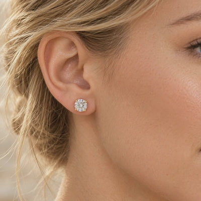 Round brilliant diamond stud earring in yellow gold, shown worn on the ear in a close-up video.