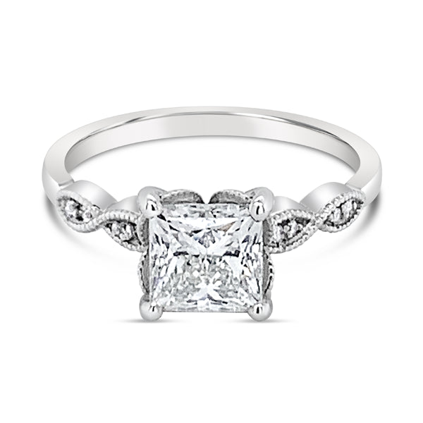 A platinum princess cut diamond ring with accent shoulder diamonds, totaling 1.75 carats.